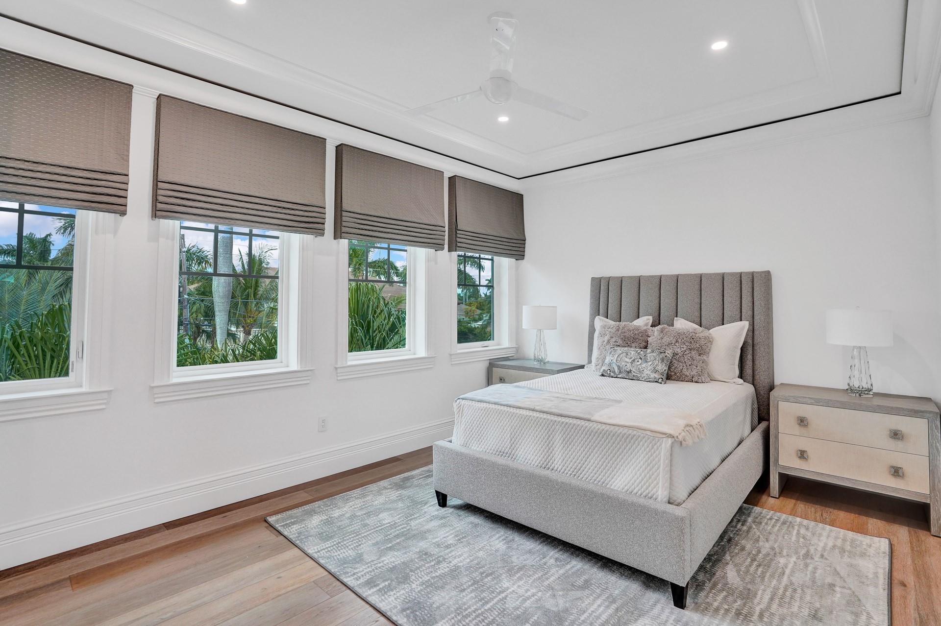 Spacious guest bedroom with walk-in closet and ensuite bathroom.