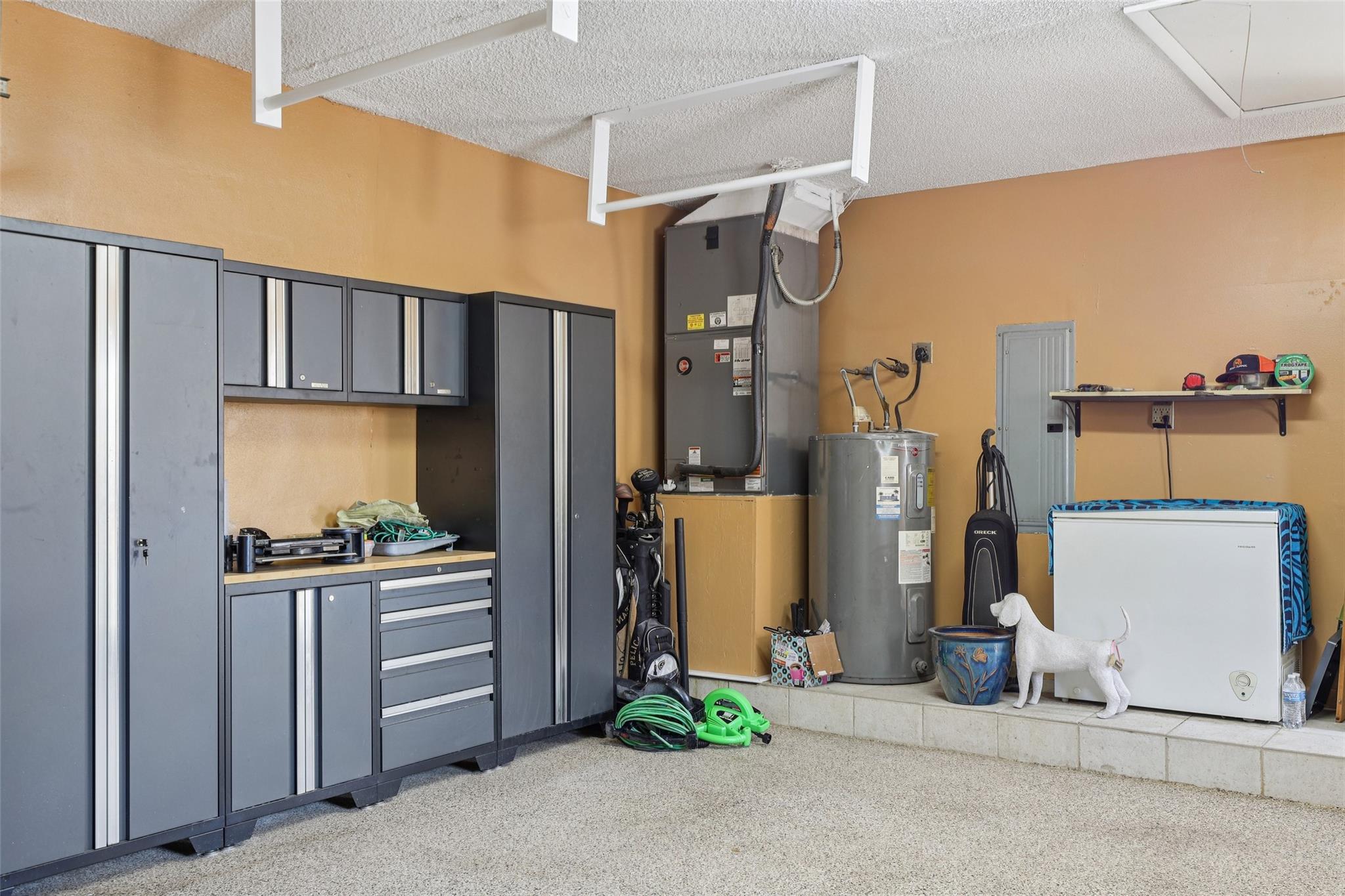 Large garage with newer AC unit.