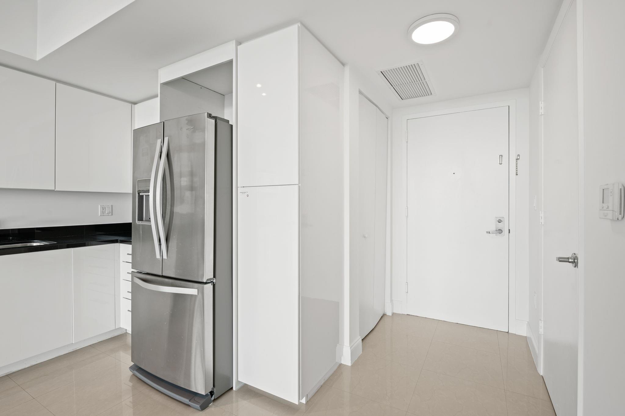 FUNCTIONAL ENTRY FOYER WITH POWDER ROOM AND LAUNDRY CLOSET