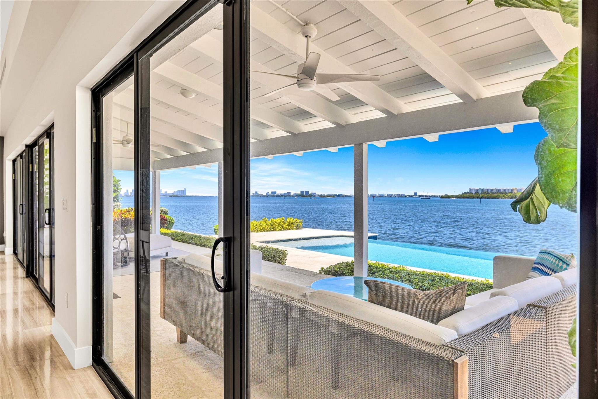 Living areas open to a covered porch Bay side