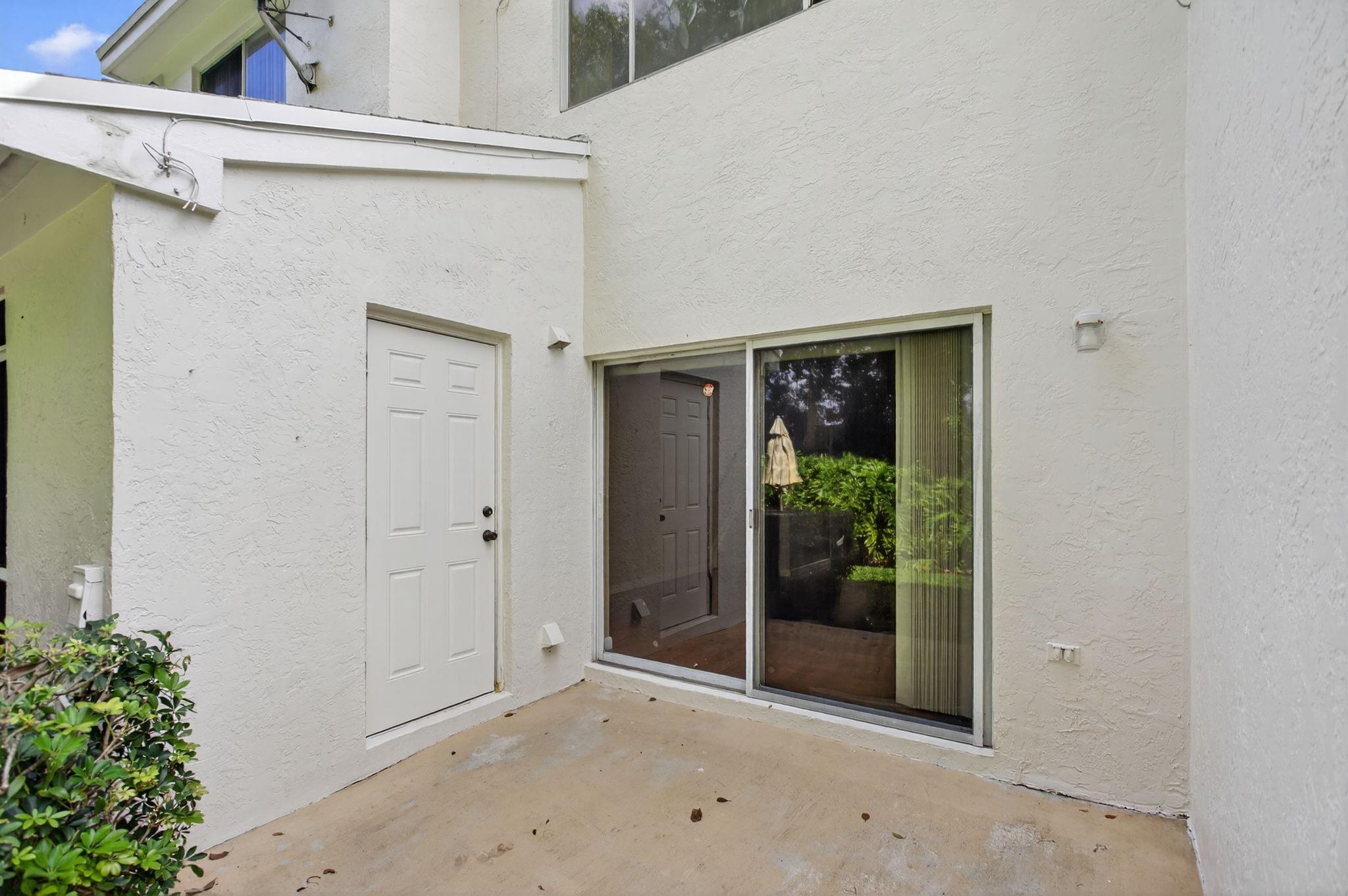 Patio with a private storage room.
