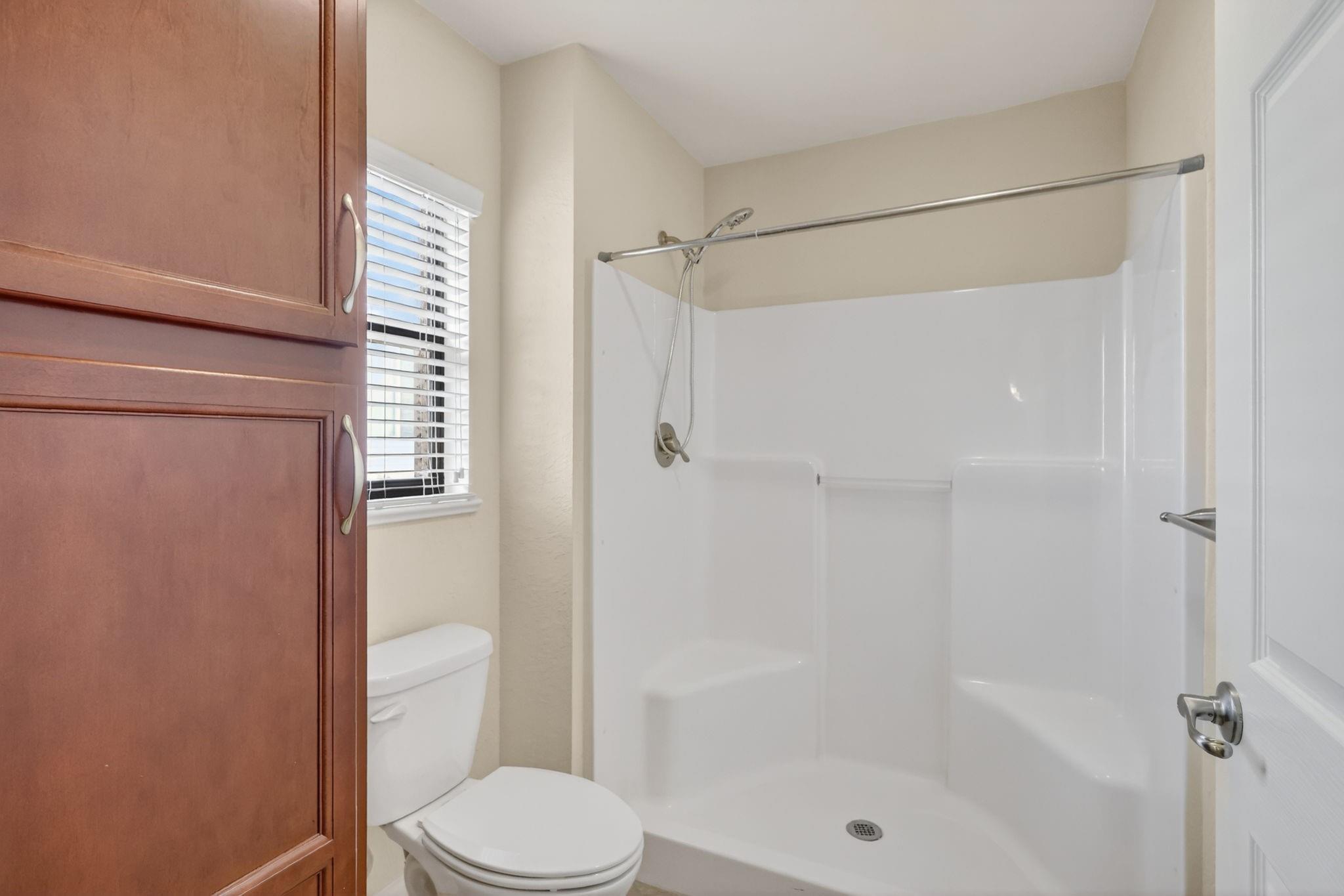master bathroom with extra cabinets and bathfitter