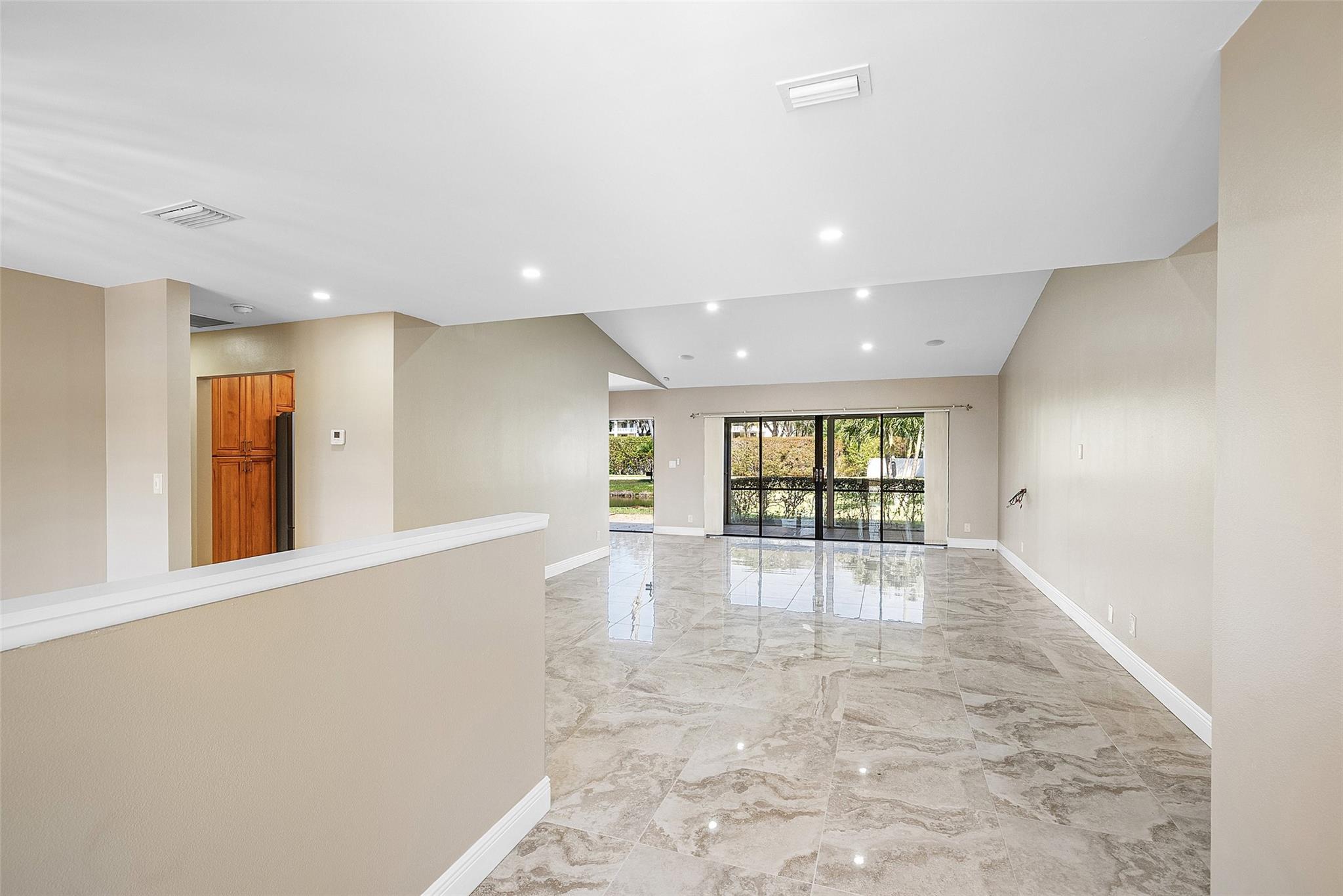 Spacious great room as you walk in front door/foyer space. High ceiling height with smooth ceilings- NO POPCORN!