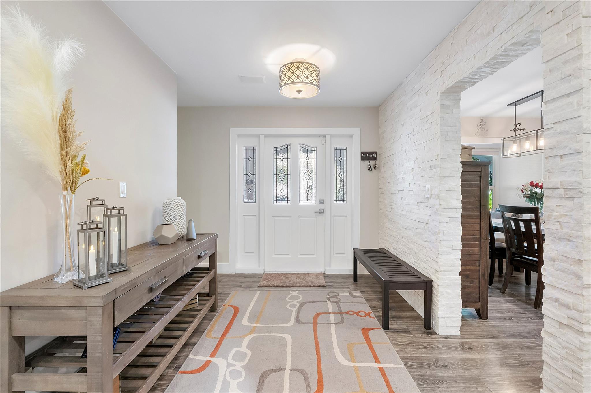 As you enter this doorway you are met with a sprawling open floor plane of areas for all the family combined, This is the interior entryway as you come into the home,