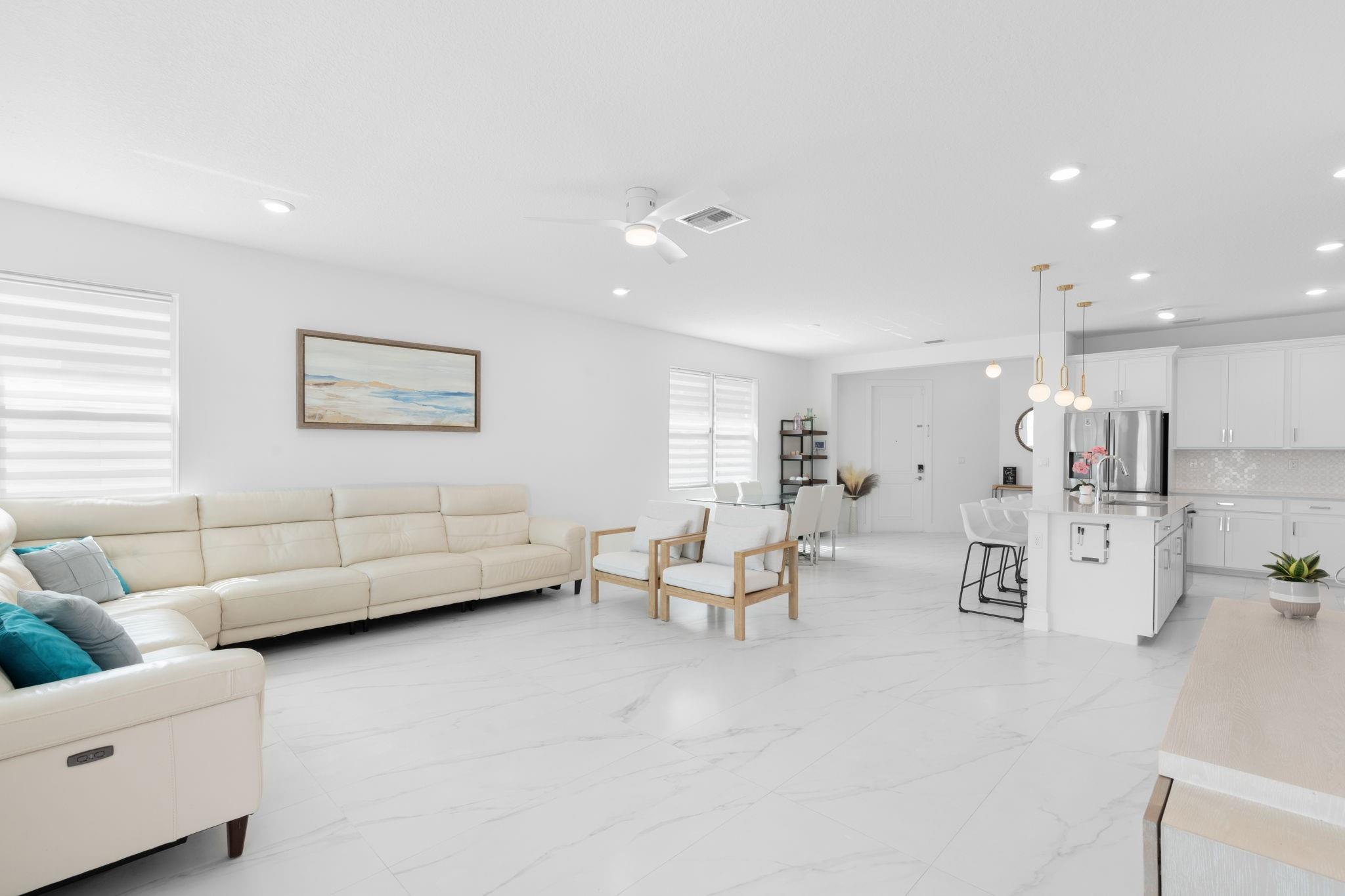 Spacious Open Concept Allows for Large Furniture Pieces in Living Room and Dining Room