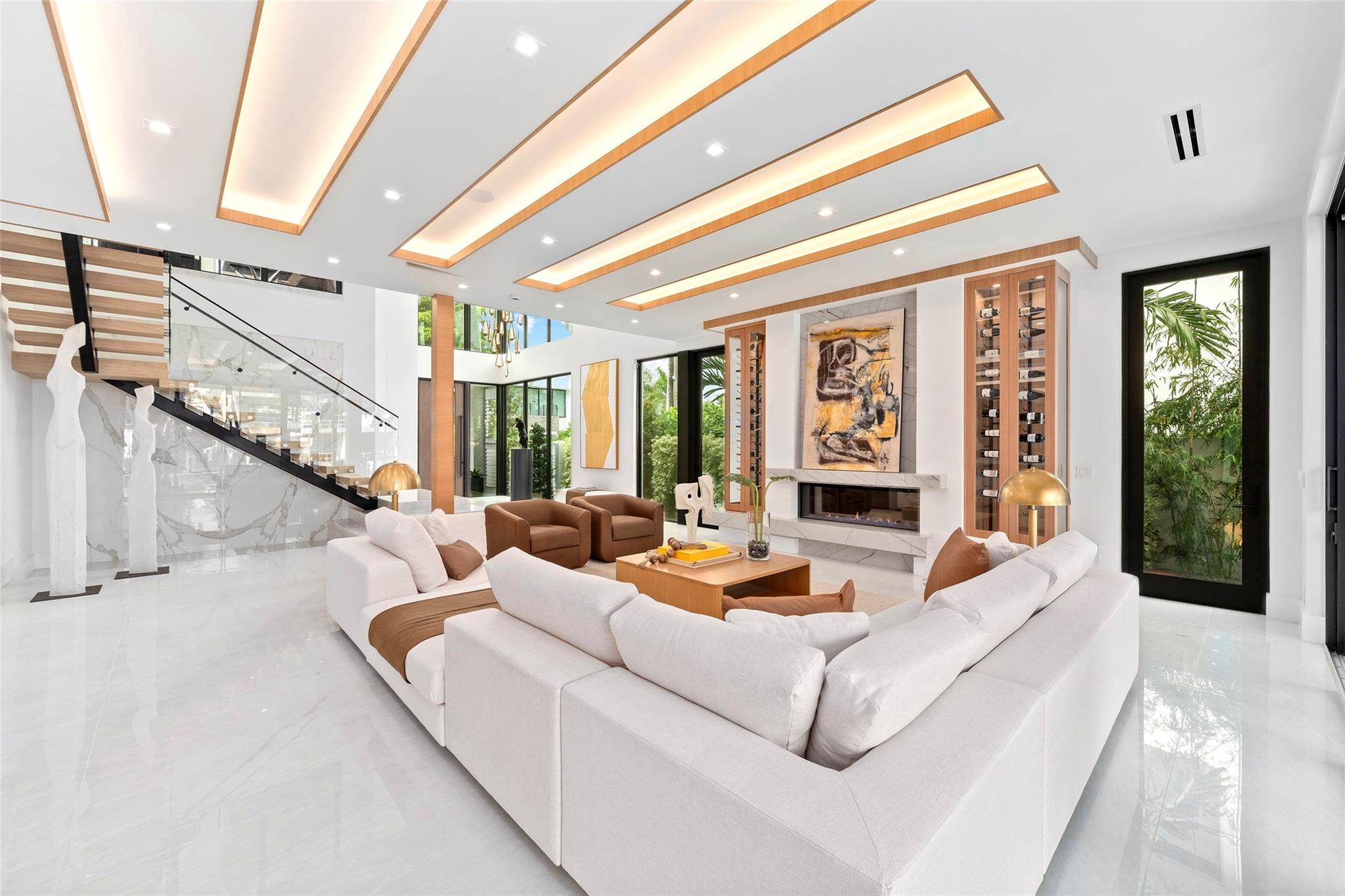 grand open space with soaring ceilings and breathtaking water views, A Fireplace, Custom Wine Storage,