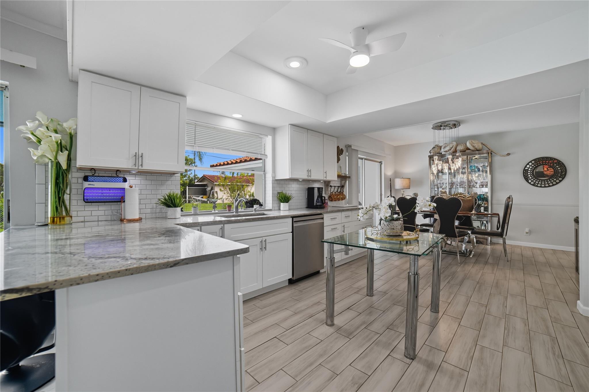 Open concept remodeled kitchen, shaker style wood cabinets, granite countertops, tile backsplash, stainless steel appliances, new Bosch dishwasher, breakfast/snack bar