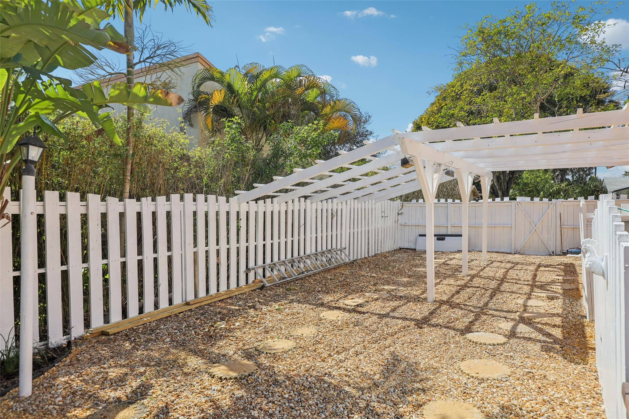 Side yard is large enough to hold sizable RV, additional parking, or boat. Could be an excellent gardening spot or additional place to find shade.