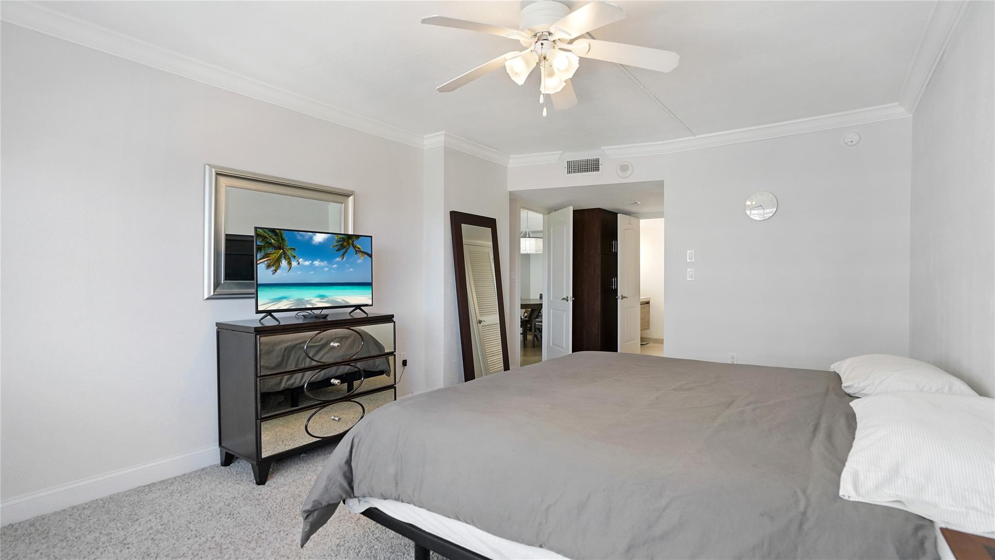 The entrance to the primary ensuite bathroom is to the right.