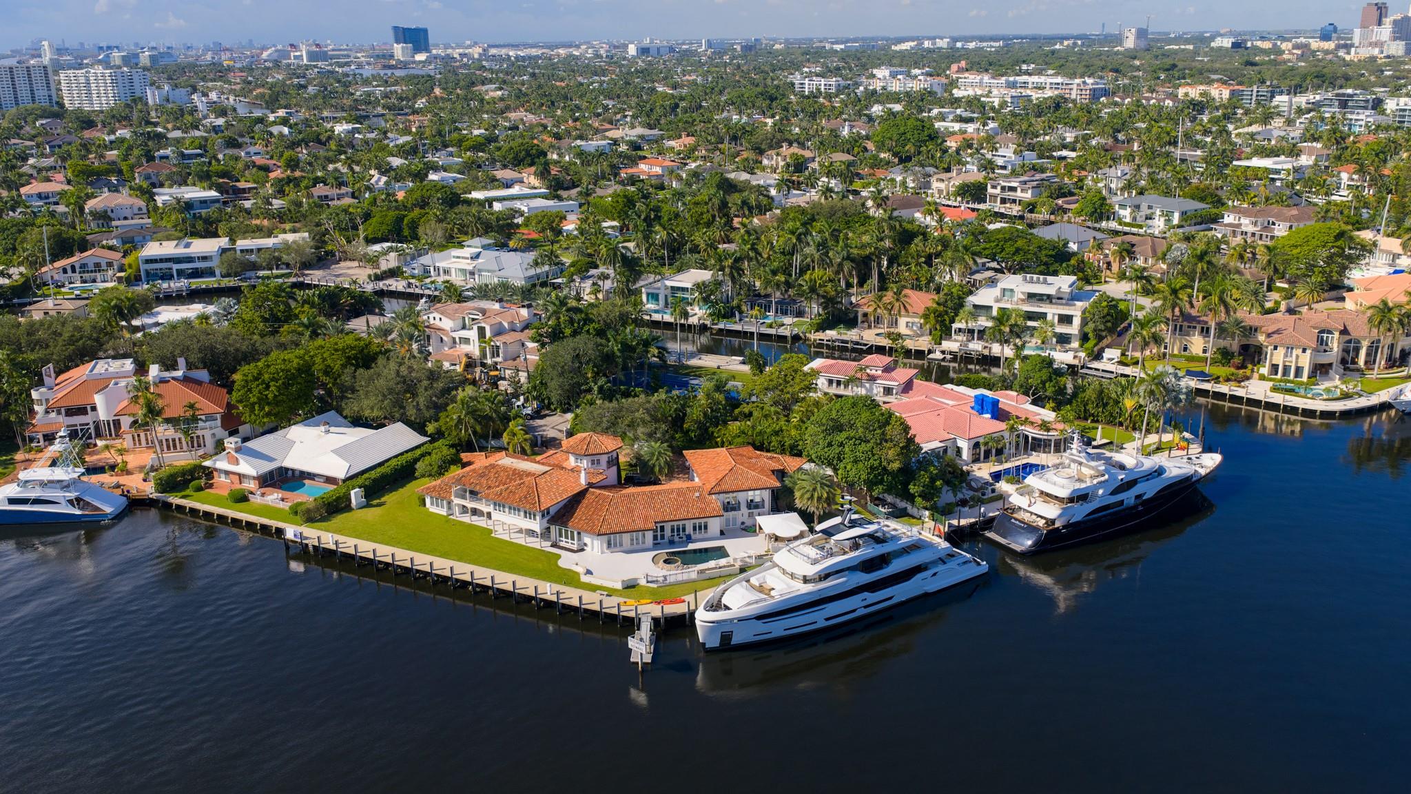 Expansive point-lot estate with 315 feet of waterfront, skyline views, and mega-yacht dockage along Fort Lauderdale’s premier waterways.