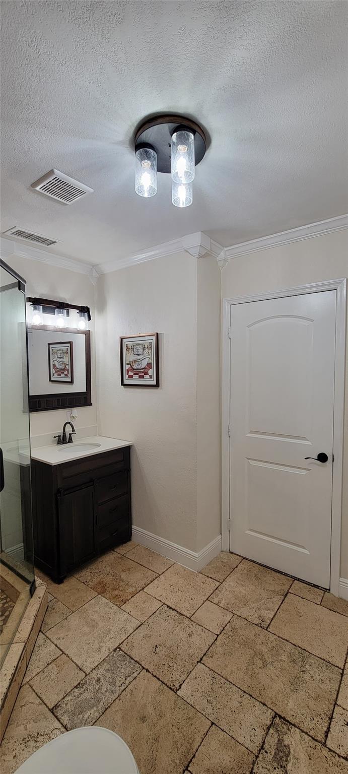 Updated bathroom featuring modern fixtures and finishes