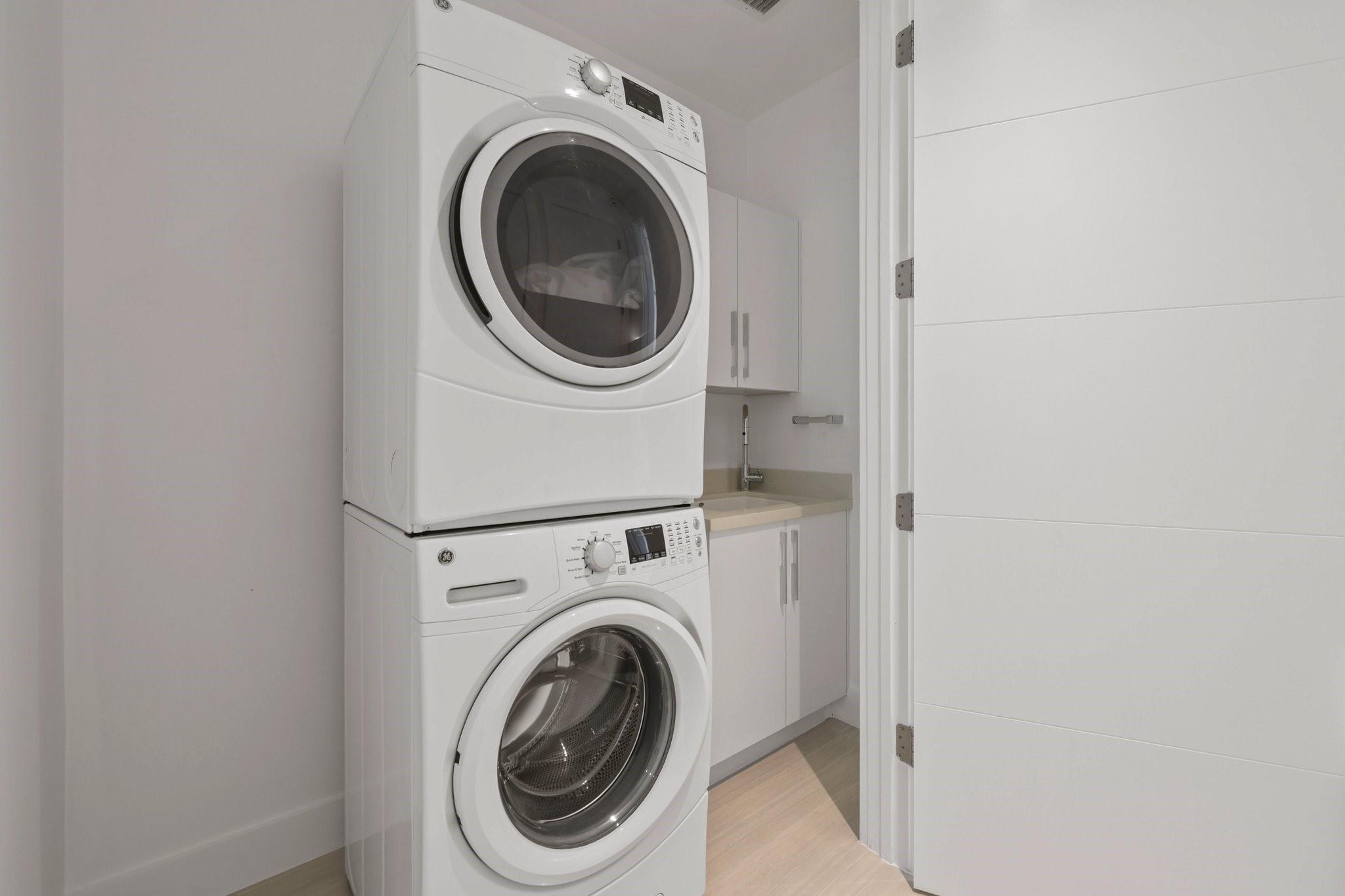 Full size washer and dryer plus laundry sink