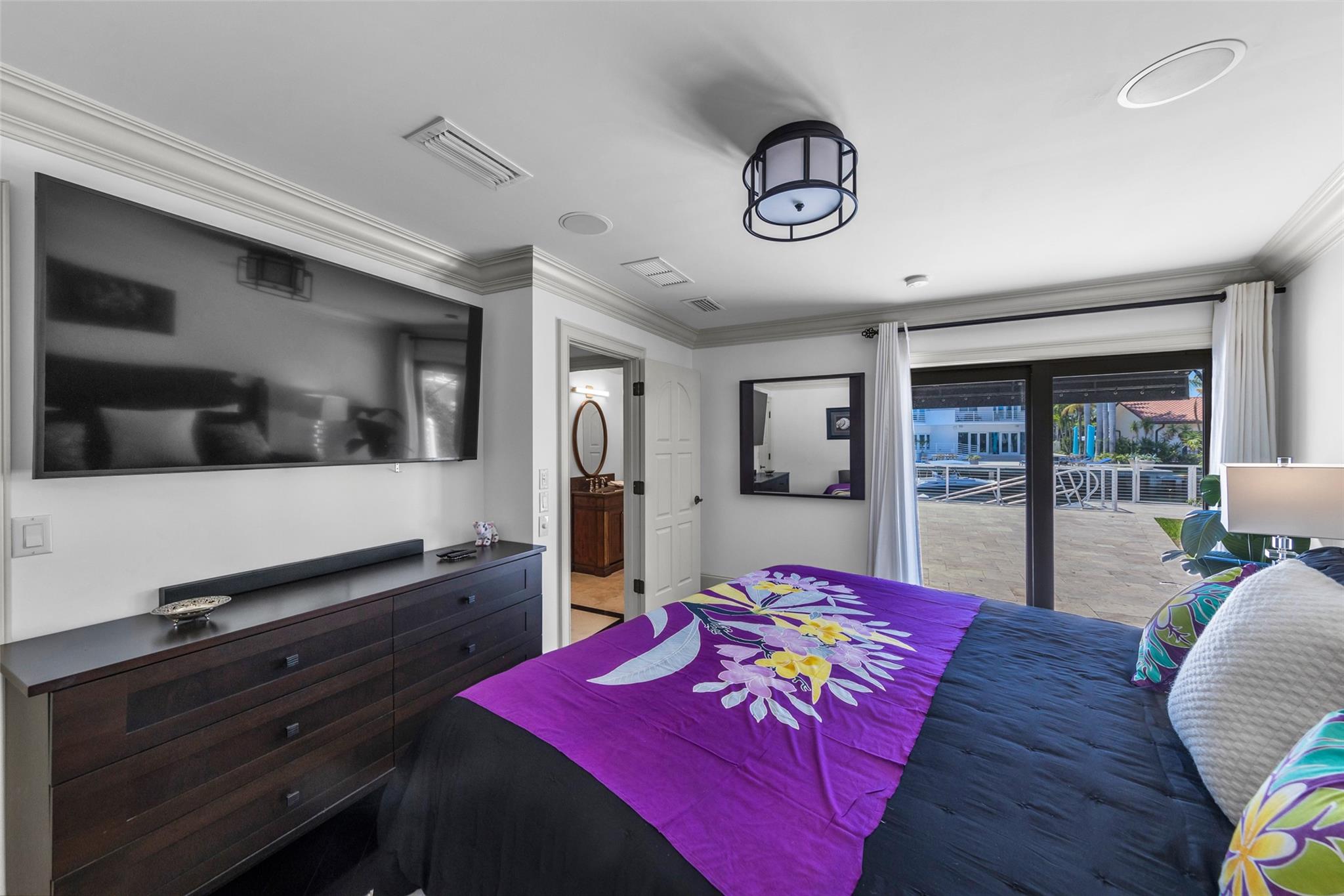 Bedroom with back patio, pool & water views