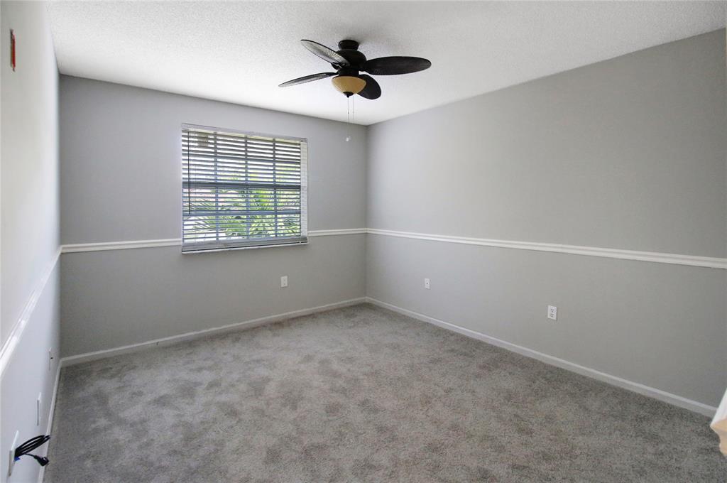 Photo for 6890 NW 75th Court, Parkland, FL 33067 - Listing #FX-10427148 bedroom on front right of home, adjacent to guest bathroom