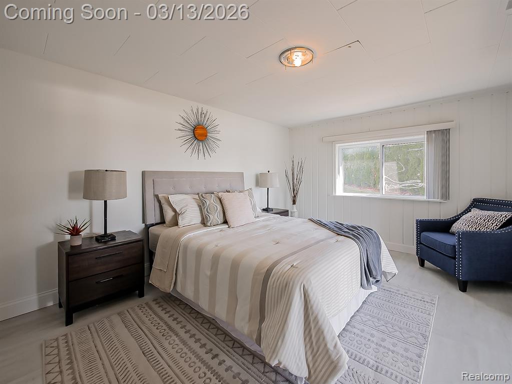 Bedroom with access to exterior and light wood-type flooring