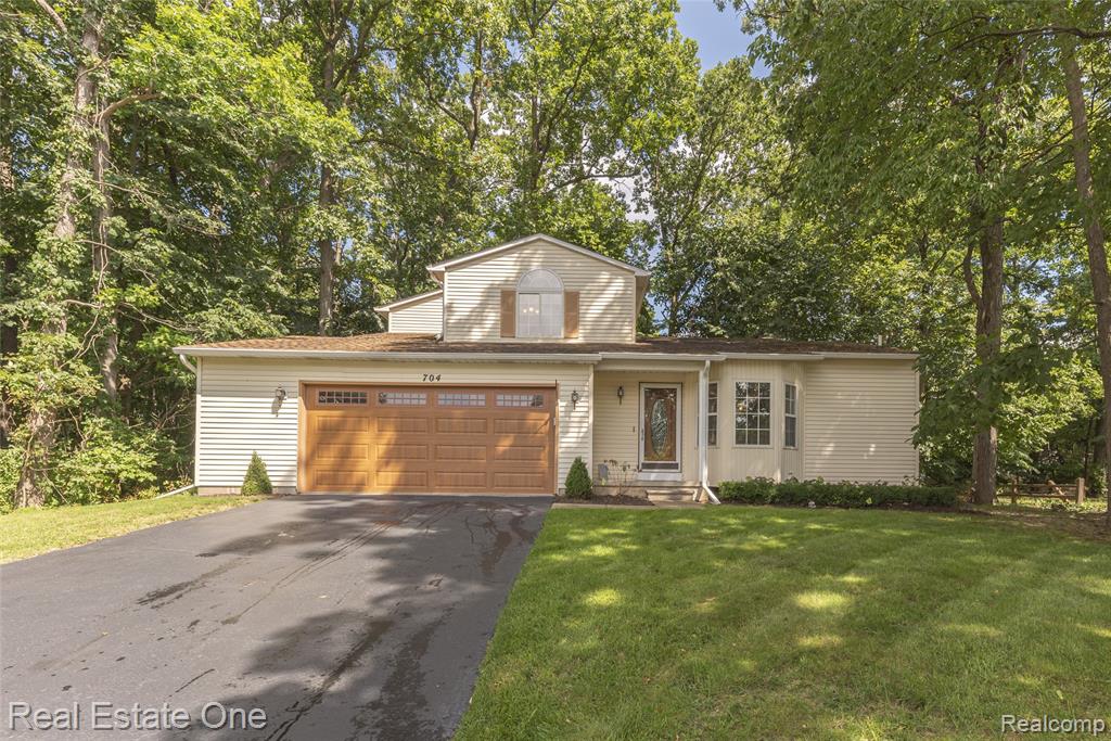 704 Grand Court, South Lyon, MI 48178 — front exterior