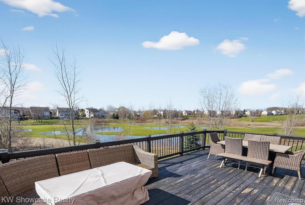 Wooden terrace with a water view and an outdoor living space
