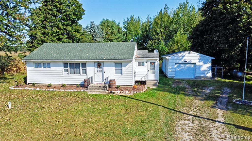 6392 Mitchell Road, Palmyra, MI 49268 — front exterior