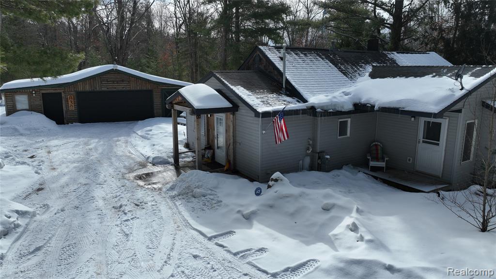 838 E Pere Cheney Road, Roscommon, MI 48653 — front exterior