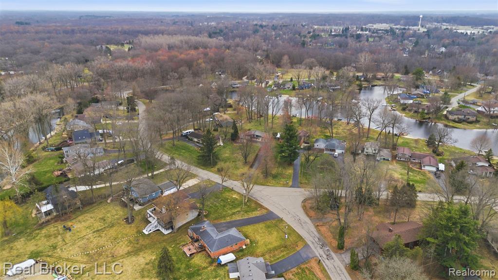 Aerial view of property's location with nearby suburban area
