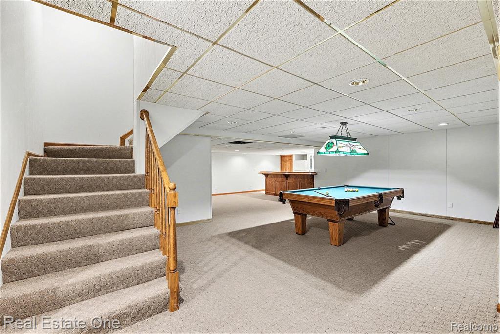 Rec room with a drop ceiling and pool table