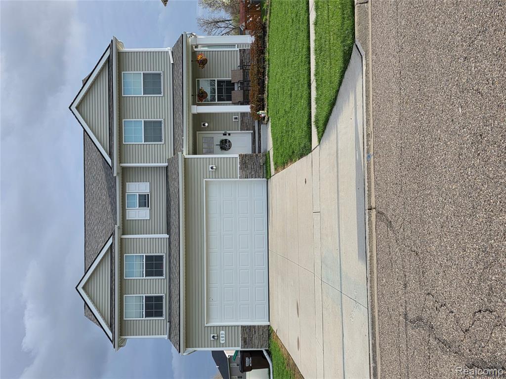683 Goldfinch Lane, Milan, MI 48160 — front exterior