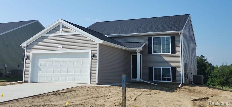 8207 Moonlight Creek Lane, Fowlerville, MI 48836 — front exterior