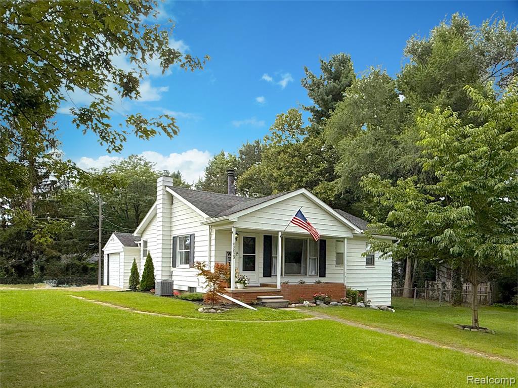 63023 Ivy Drive, Washington, MI 48095 — front exterior