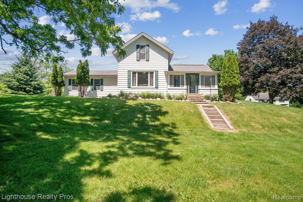 67640 W 8 MILE Road, South Lyon, MI 48178 — front exterior