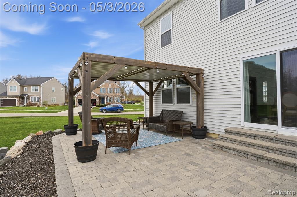 View of patio / terrace with a pergola, a residential view, entry steps, and an outdoor living space