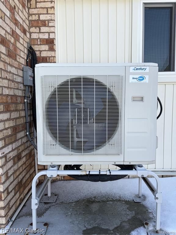 Exterior view of board and batten siding and brick siding