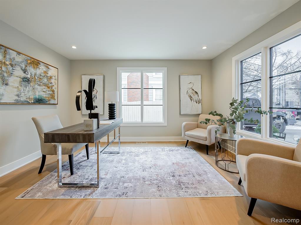 Home office featuring light wood-style floors and recessed lighting