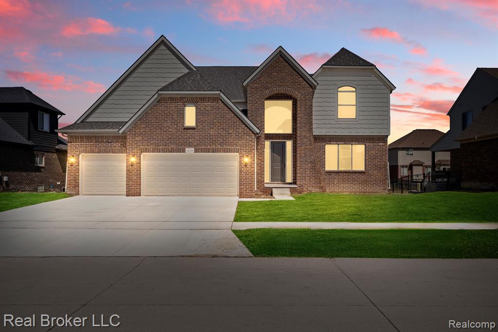 View of front of home with brick siding and stone siding