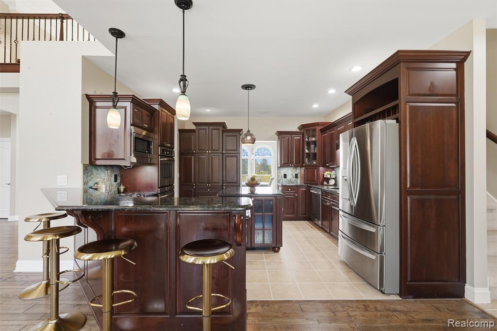 4148 Queensland Way, Pinckney, MI 48169 — Photo 18