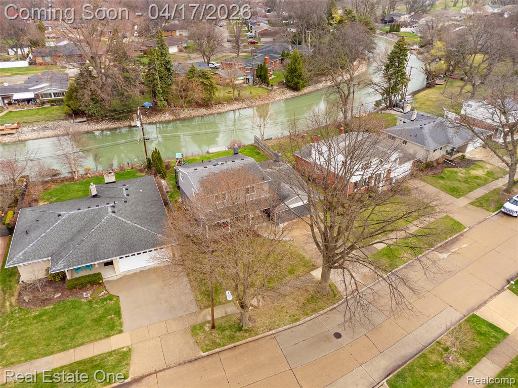 Aerial view of residential area featuring a large body of water