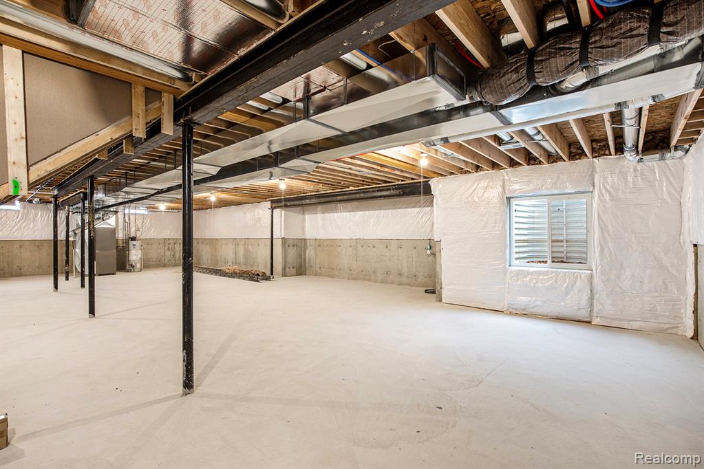 Below grade area with water heater and oil tank