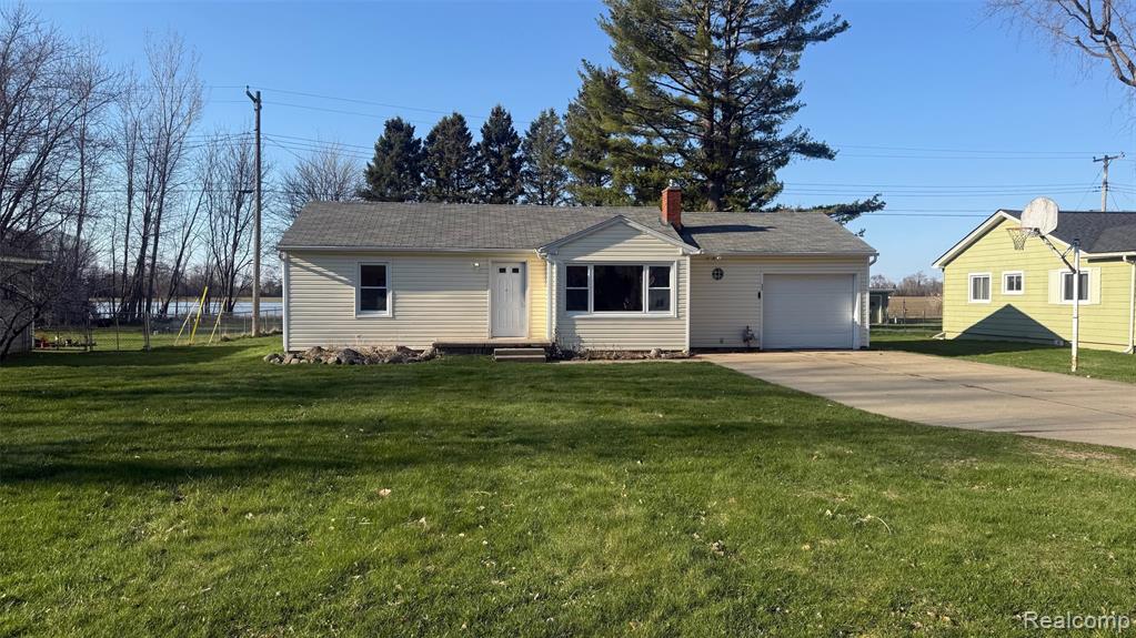 393 Almont Avenue, Almont, MI 48003 — front exterior