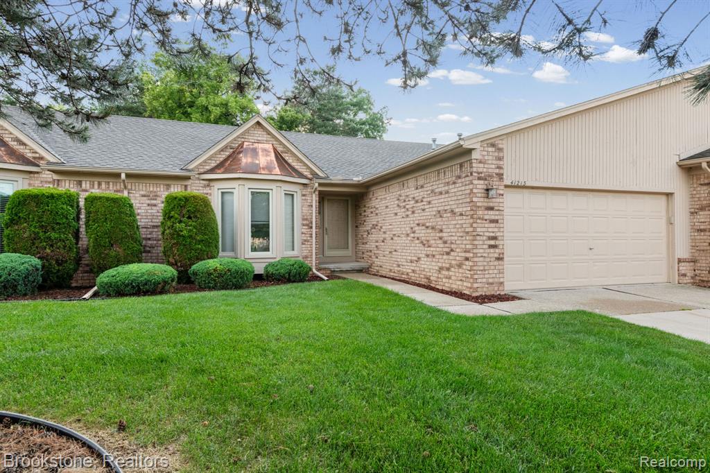 41213 Whispering Oaks Drive, 19, Clinton Twp, MI 48038 — front exterior