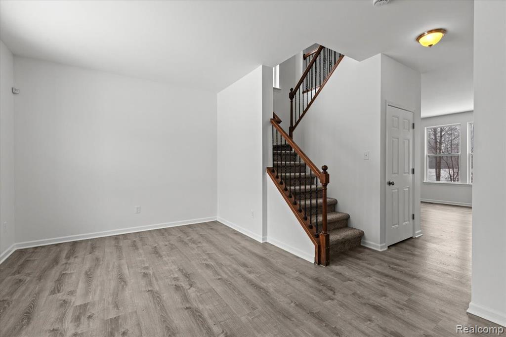 Laundry area featuring cabinet space, hookup for a washing machine, and light tile patterned flooring