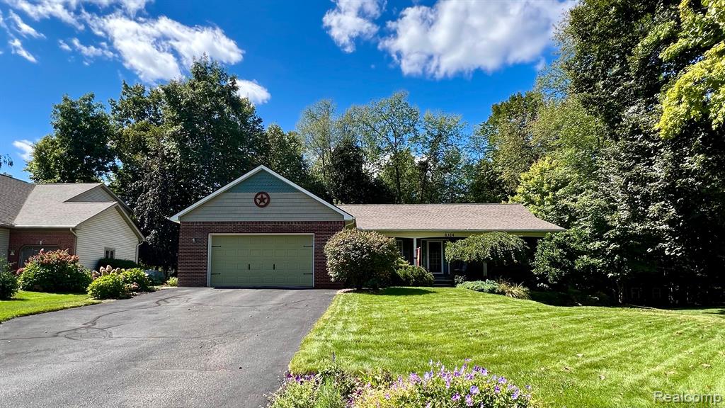 8324 WOODLAND Circle, Goodrich Vlg, MI — front exterior