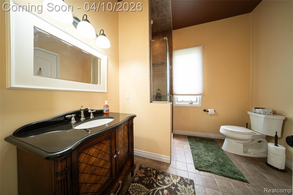 Bathroom featuring vanity and light tile patterned floors