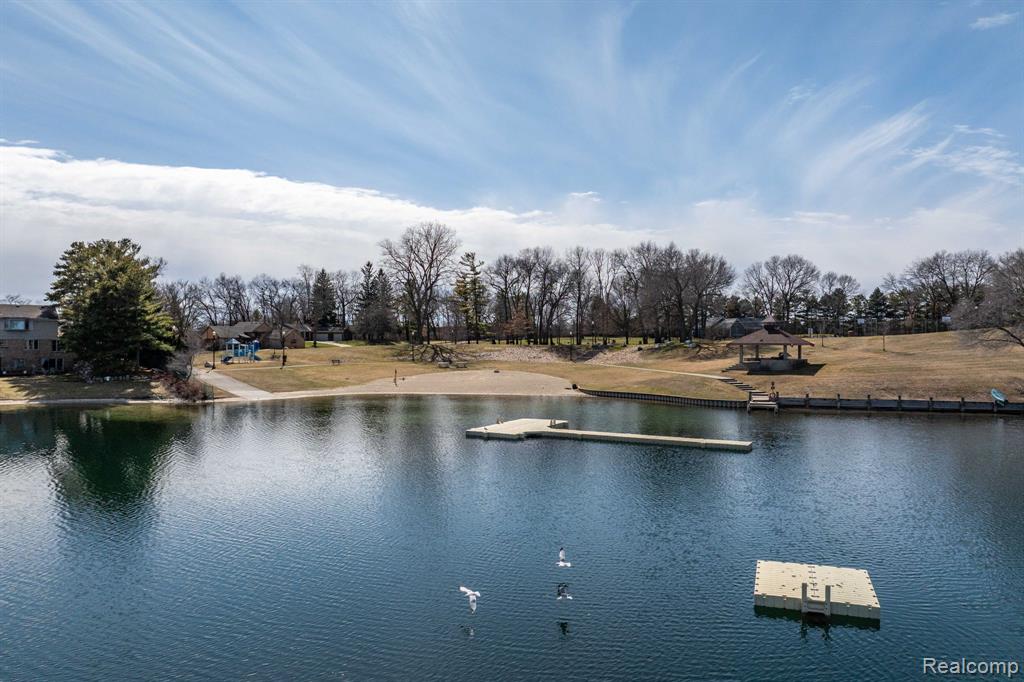 Water view featuring a floating dock