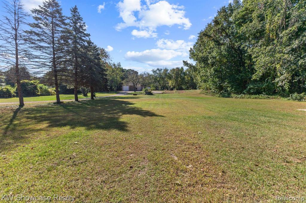 766 WHITE HOUSE Drive, Highland, MI 48356 — Photo 52