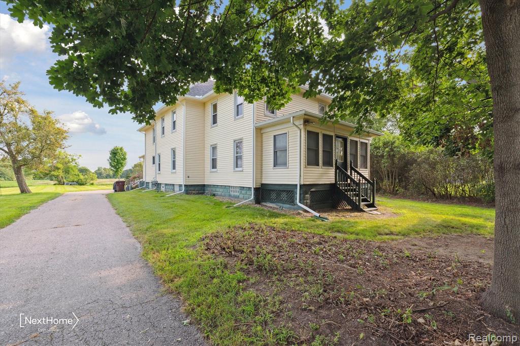 47105 BEMIS Road, Sumpter, MI 48111 — front exterior
