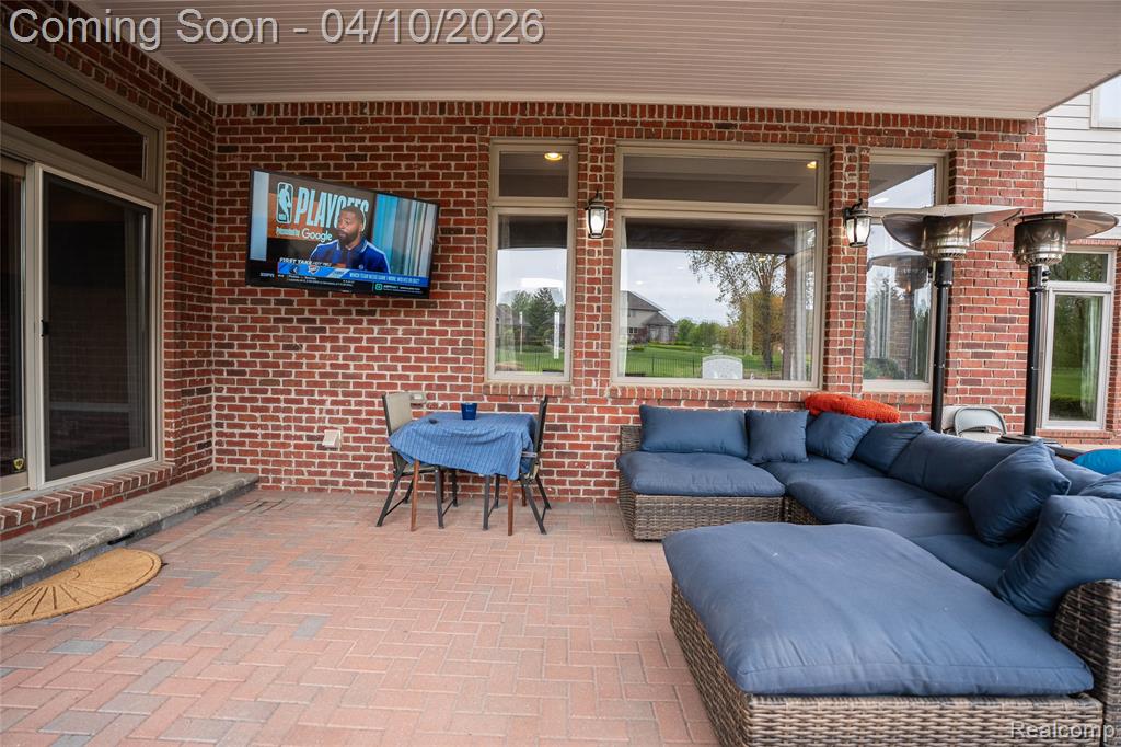 View of patio / terrace with an outdoor living / dining area