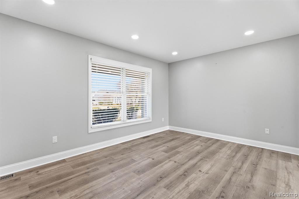 Unfurnished room with recessed lighting and light wood-style floors