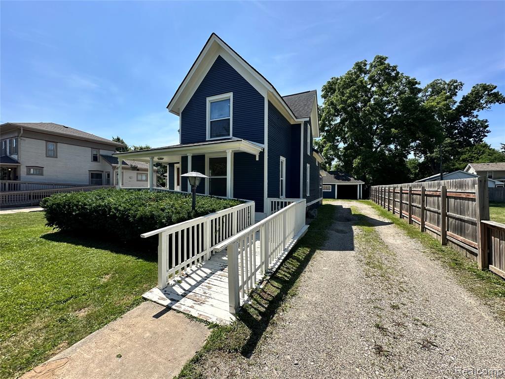 715 E GRAND RIVER Avenue, Howell, MI 48843 — front exterior