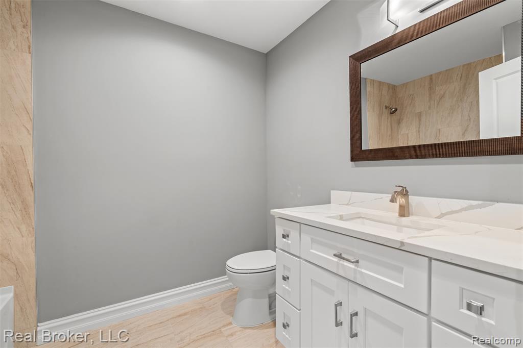 Full bathroom with vanity and a shower