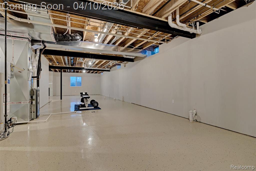 Basement featuring water heater