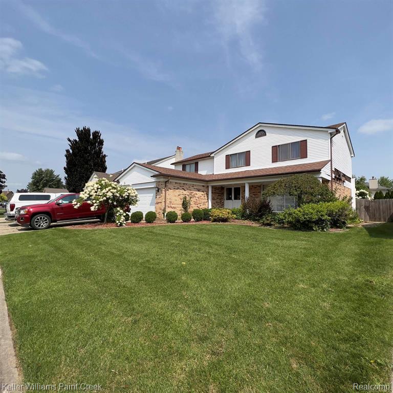 47064 Sarnus Drive, Macomb, MI 48044 — front exterior